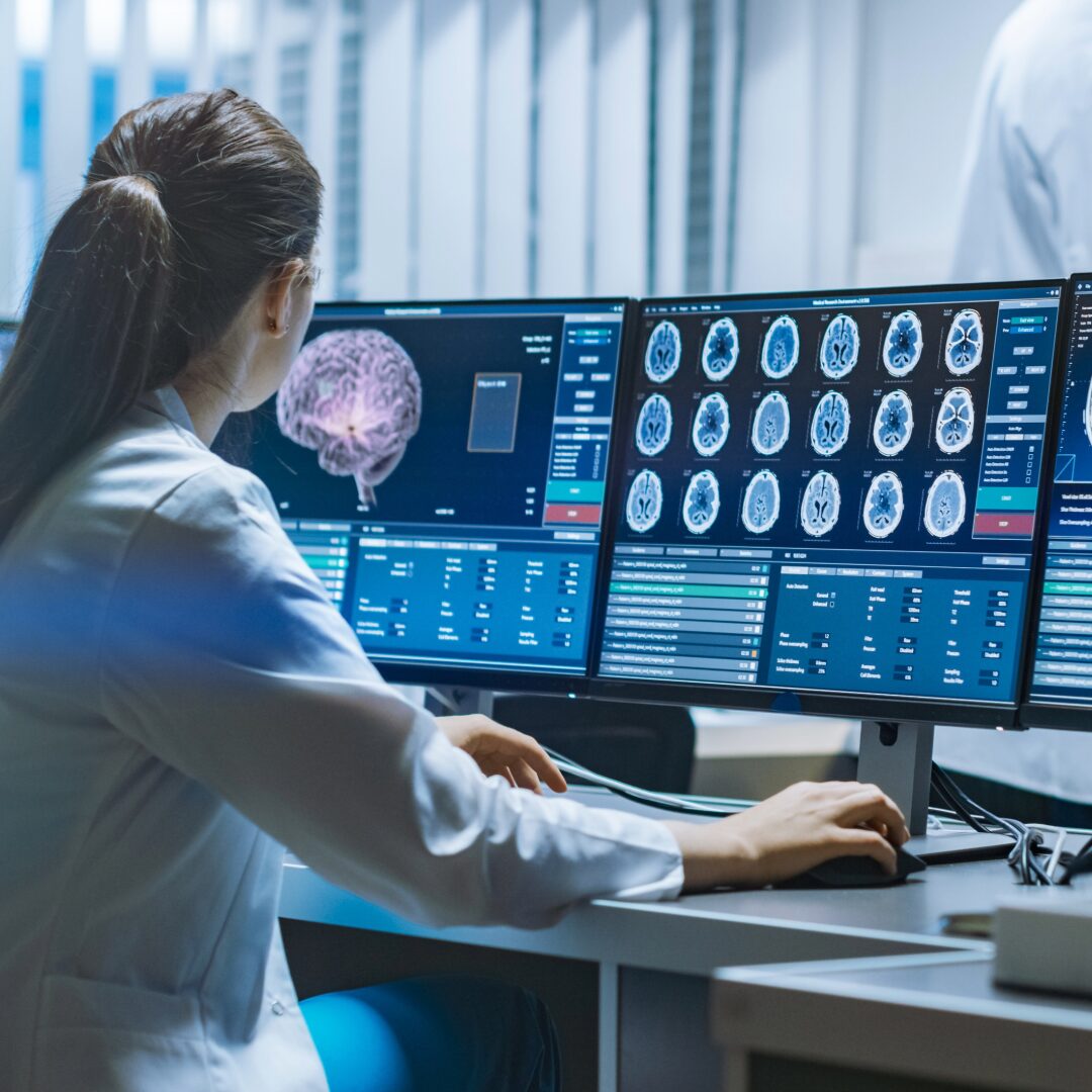 Medical Care worker looks at records on a computer